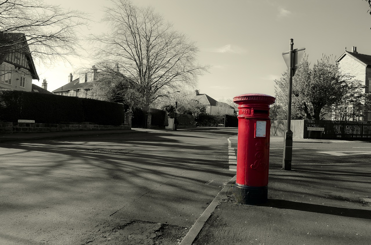Mailbox Service image - red post box on street